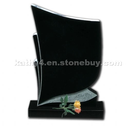 black granite headstone with carved roses