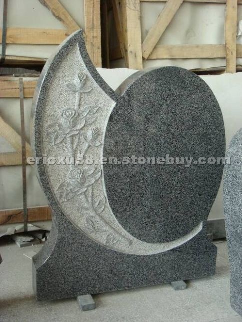 Grey Cemetery Tombstone with Carving