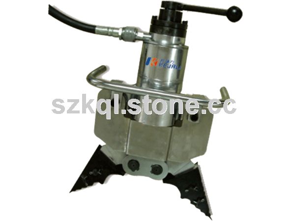 Hydraulic spreadstone implement