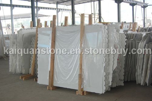 bundles of white marble slabs
