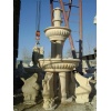carved yellow limestone fountain