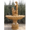 Statued yellow limestone water fountain