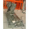 Green granite tombstone