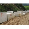 Wire-dressed white marble blocks